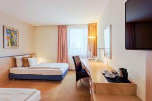 Postel nebo postele na pokoji v ubytování Best Western Macrander Hotel Frankfurt/Kaiserlei