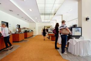 a group of people standing in a room at Best Western Macrander Hotel Dresden in Dresden