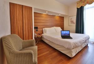 Postel nebo postele na pokoji v ubytování Best Western Hotel Piemontese