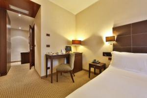 Postel nebo postele na pokoji v ubytování Best Western Hotel Piemontese