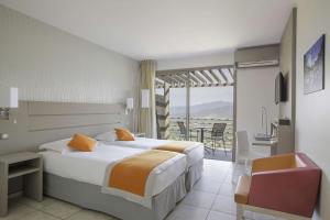 Postel nebo postele na pokoji v ubytování Best Western Plus San Damianu + 37 fotografií