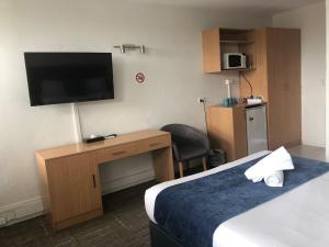 Postel nebo postele na pokoji v ubytování Parkdale Motor Inn