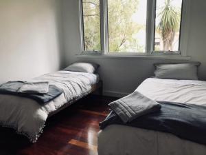 Кровать или кровати в номере Gallery House Dwellingup