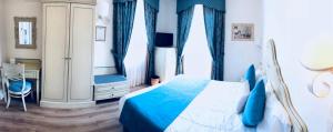 Postel nebo postele na pokoji v ubytování Hotel Goya