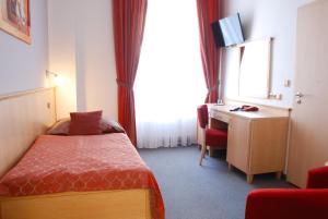 Posteľ alebo postele v izbe v ubytovaní Lázeňský Hotel Sadový Pramen