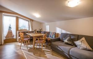 a living room with a couch and a table at Apart Heim in Fügen