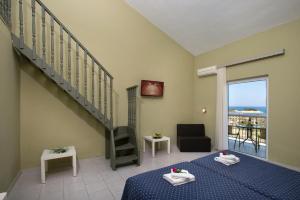 A bed or beds in a room at Panorama Sidari