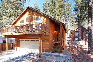 a log cabin with a large balcony and a garage at North Shore - Golden Pine in Kings Beach