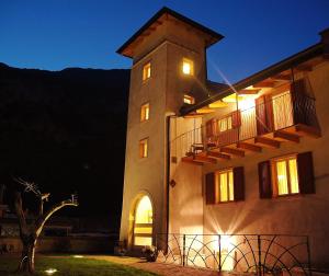 a building with a staircase on the side of it at night at Giardino alla Torre Bed&Breakfast in Dro