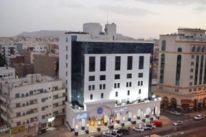 an aerial view of a city with buildings at Zaha Al Munawara Hotel in Al Madinah