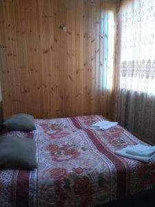 Postel nebo postele na pokoji v ubytování Guest House Guliada
