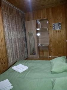 Postel nebo postele na pokoji v ubytování Guest House Guliada
