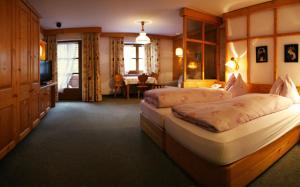 En eller flere senger på et rom på Hotel-Gasthof "Zur Mühle"