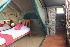 Postel nebo postele na pokoji v ubytování Kidepo Savannah Lodge by NATURE LODGES LTD