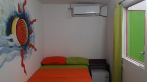Cama ou camas em um quarto em Hospedaje San Andres Vive Centro
