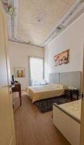 Кровать или кровати в номере Vip Bergamo Rooms