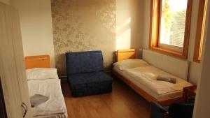 Postel nebo postele na pokoji v ubytování Holiday Park Vrchlabí - Liščí farma