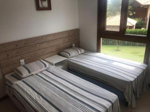 Postel nebo postele na pokoji v ubytování Bali Bahia Itacimirim + 28 fotografií