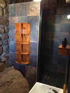 a bathroom with a sink and a shower at Gondwana Canyon Lodge in Kanebis