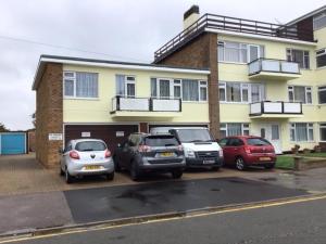 a group of cars parked in front of a building at 9 Gunfleet court in Clacton-on-Sea