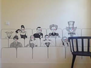 a wall mural of a group of villains at Santiago 31 Hostel in Guimarães
