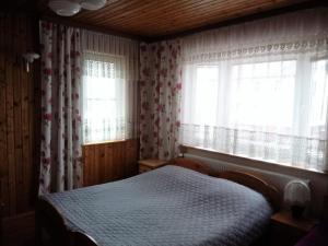 Postel nebo postele na pokoji v ubytování Pokoje PETRA pod Bocianem