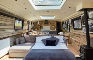 a living room with a bed in a rv at The Boathouse in London