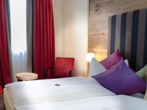Postel nebo postele na pokoji v ubytování Hotel Post