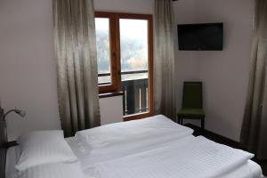 Postel nebo postele na pokoji v ubytování Hotel Rupertihaus