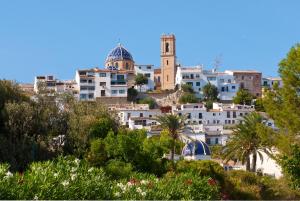 a view of a city with buildings and trees at Gran H La Marina in Altea