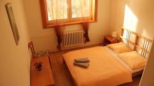 Postel nebo postele na pokoji v ubytování Holiday Park Vrchlabí - Liščí farma