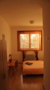 Postel nebo postele na pokoji v ubytování Holiday Park Vrchlabí - Liščí farma