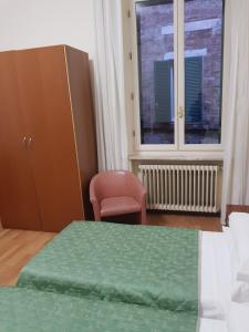 Postel nebo postele na pokoji v ubytování Hotel Duomo