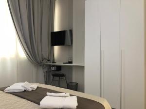 Postel nebo postele na pokoji v ubytování Turin Central Rooms