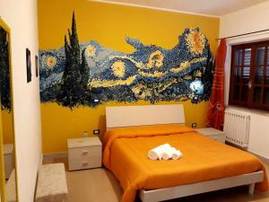 En eller flere senge i et værelse på La Dimora Degli Artisti