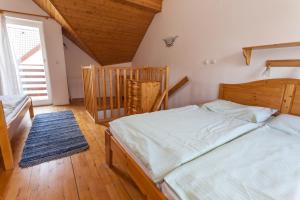 Postel nebo postele na pokoji v ubytování Apartmany Holiday Tatralandia + 34 fotografií