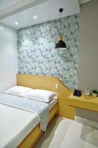 Krevet ili kreveti u jedinici u okviru objekta Hotel Formosa Daet