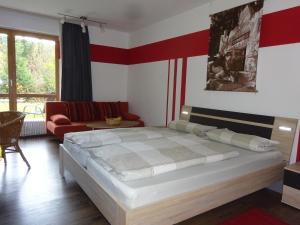 Postel nebo postele na pokoji v ubytování Gästehaus Sonneck