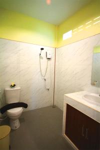 a bathroom with a shower and a toilet and a sink at AddJitResort aonang - SHA Extra Plus in Ao Nang Beach