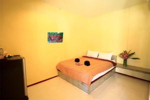 Postel nebo postele na pokoji v ubytování AddJitResort aonang - SHA Extra Plus