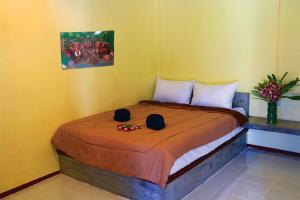 Postel nebo postele na pokoji v ubytování AddJitResort aonang - SHA Extra Plus