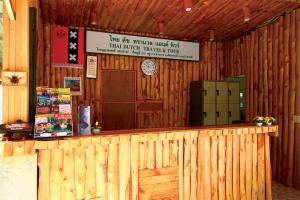 a bar in a wooden building with a sign at AddJitResort aonang - SHA Extra Plus in Ao Nang Beach