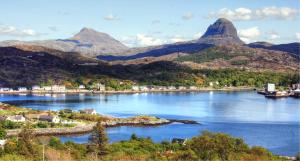 a view of a river with mountains in the background at SAORSA CABIN in Lochinver