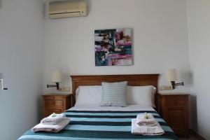 A bed or beds in a room at Los Azules de Altea