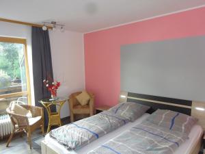 Postel nebo postele na pokoji v ubytování Gästehaus Sonneck