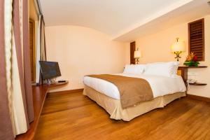 Ein Bett oder Betten in einem Zimmer der Unterkunft Hotel Bakoua Martinique