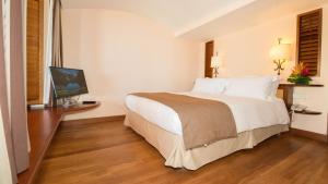 Ein Bett oder Betten in einem Zimmer der Unterkunft Hotel Bakoua Martinique