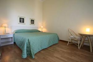 Postel nebo postele na pokoji v ubytování Hotel Duomo