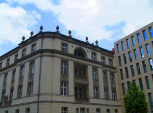 a large building with birds on the top of it at Designerwohnung Berlin Mitte in Berlin