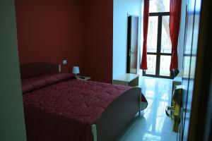 Voodi või voodid majutusasutuse Albergo Ma.Re toas